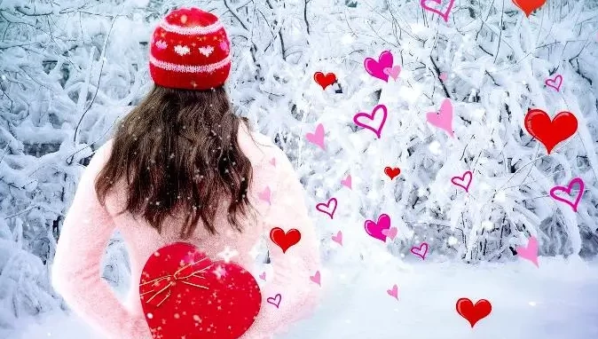 Woman with Valentine's Day hearts in the snow